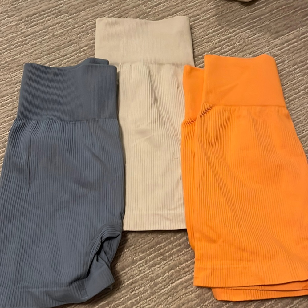 3 pairs of biker shorts blue,orange,cream